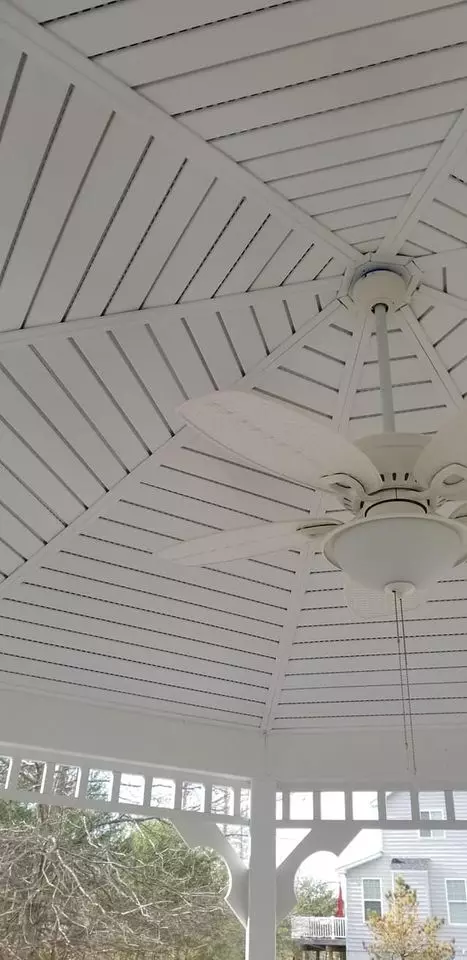 White gazebo ceiling with hanging ceiling fan