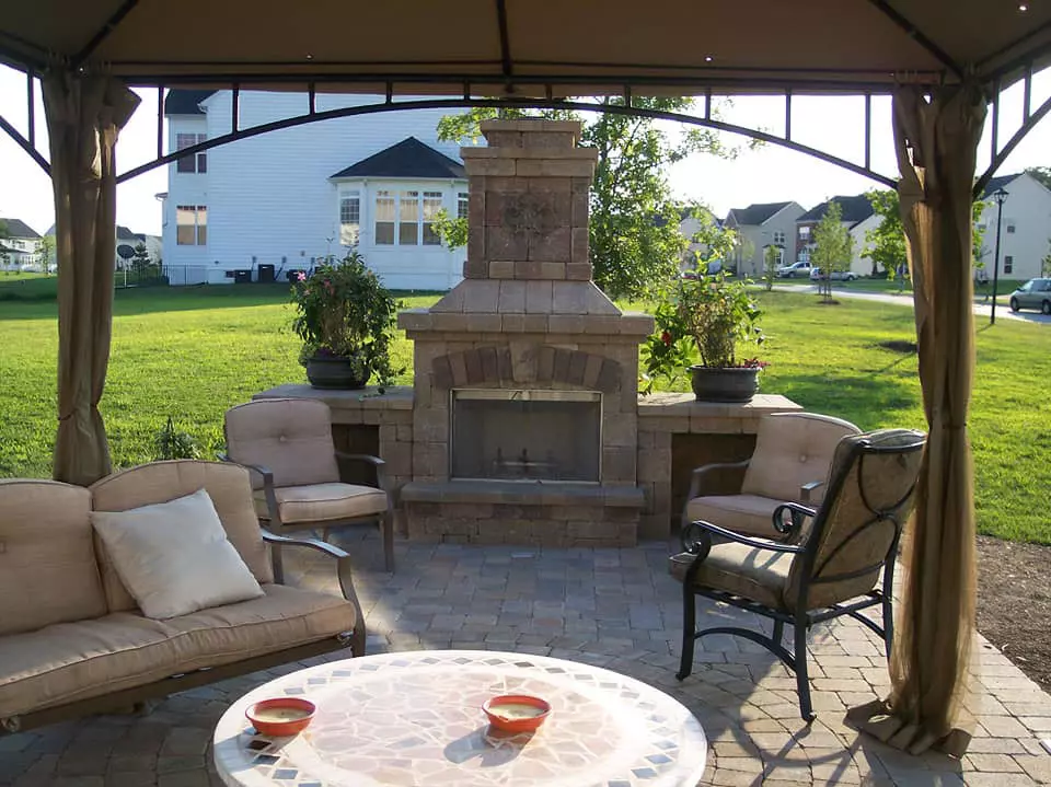 Gazebo patio with stone fireplace and seating
