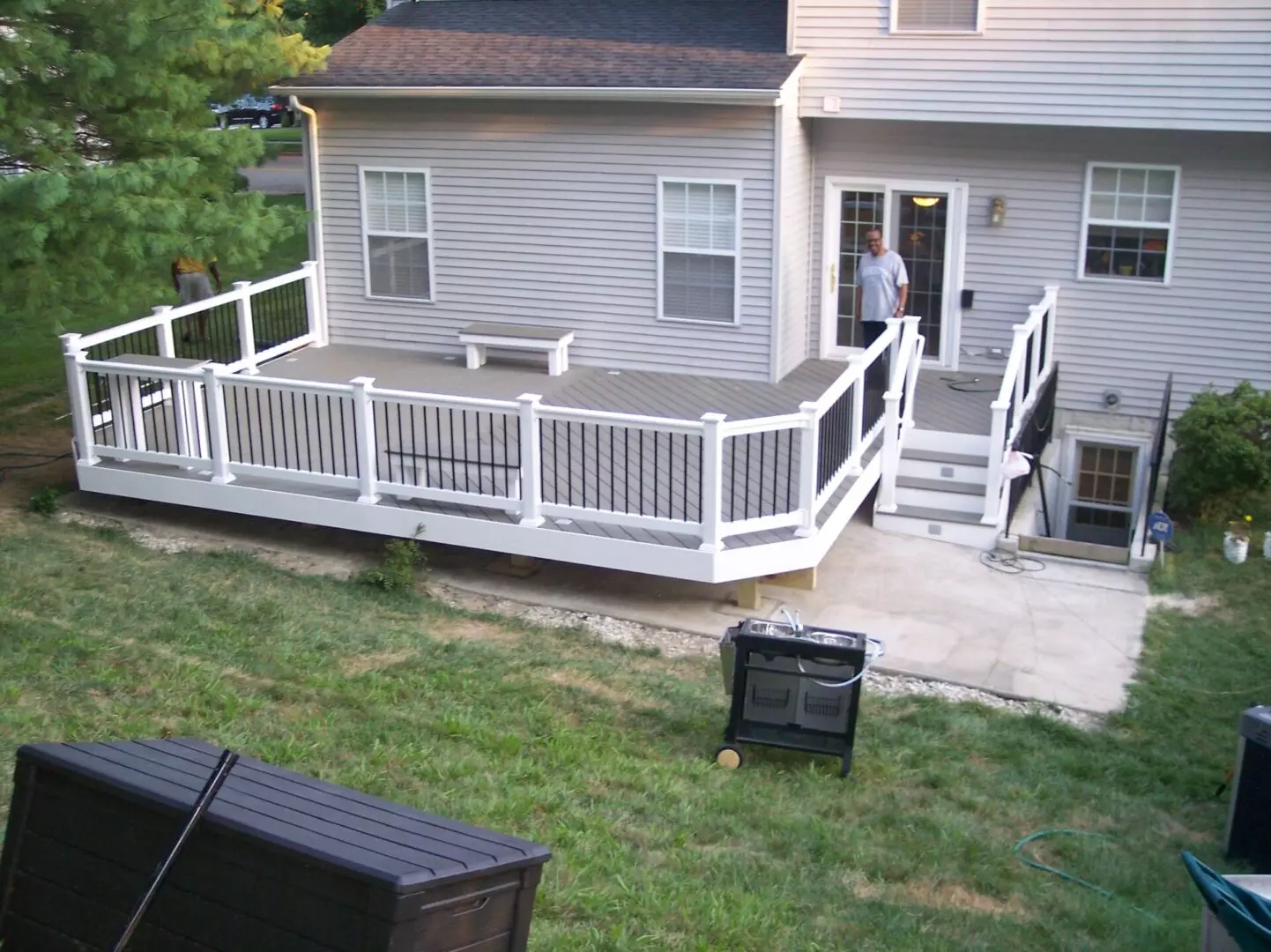 A spacious deck with a smiling man