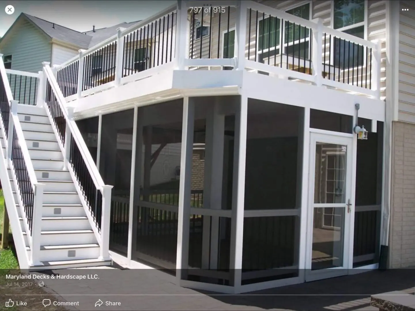White staircase leading to a screened porch on a house.