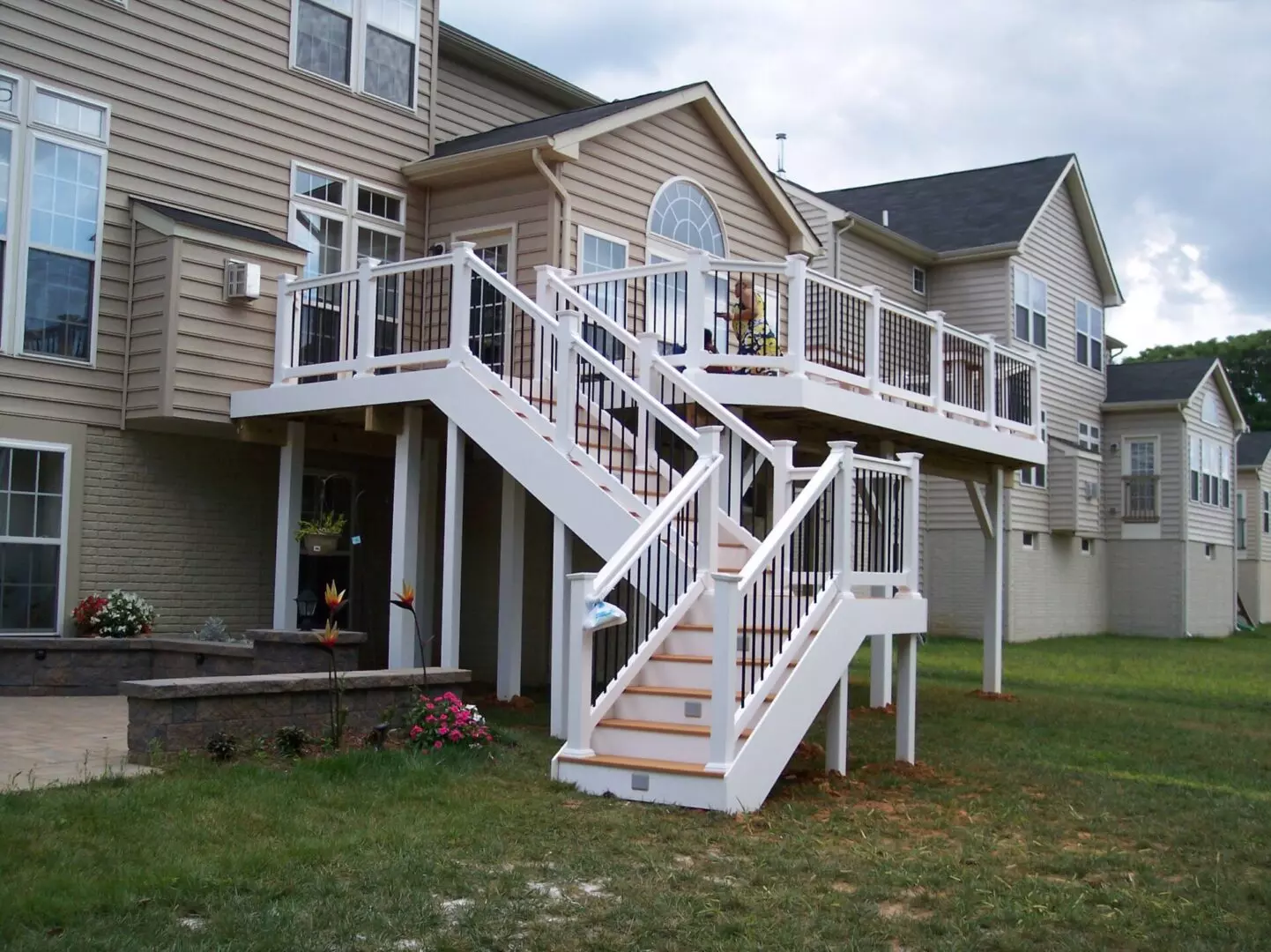 A staircase leading to an elevated white deck